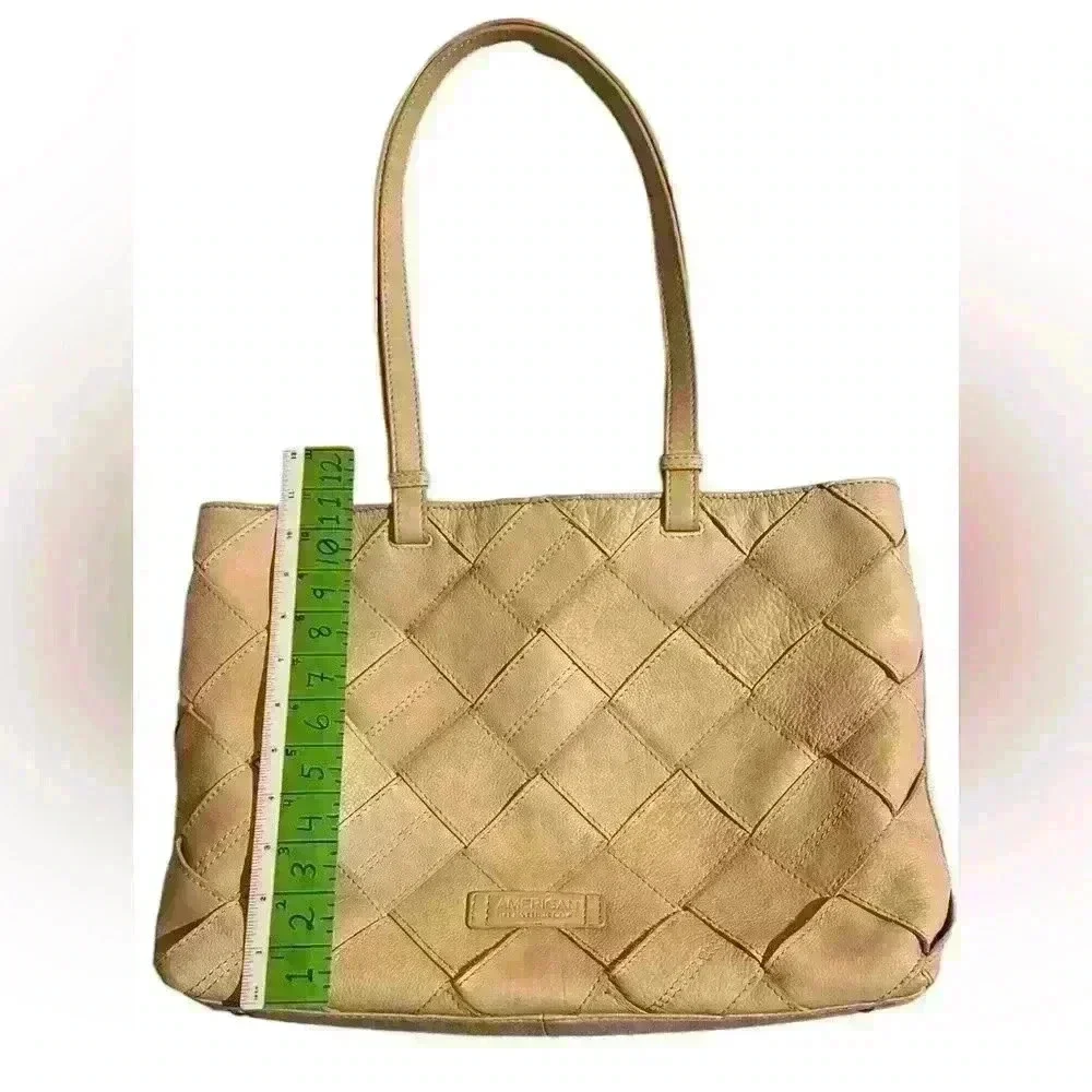 An American Leather Co. nude/cream colored leather woven tote bag.